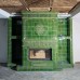 Зеленый камин с изразцами Тюльпан и облицовкой дровниц производитель Ceramica